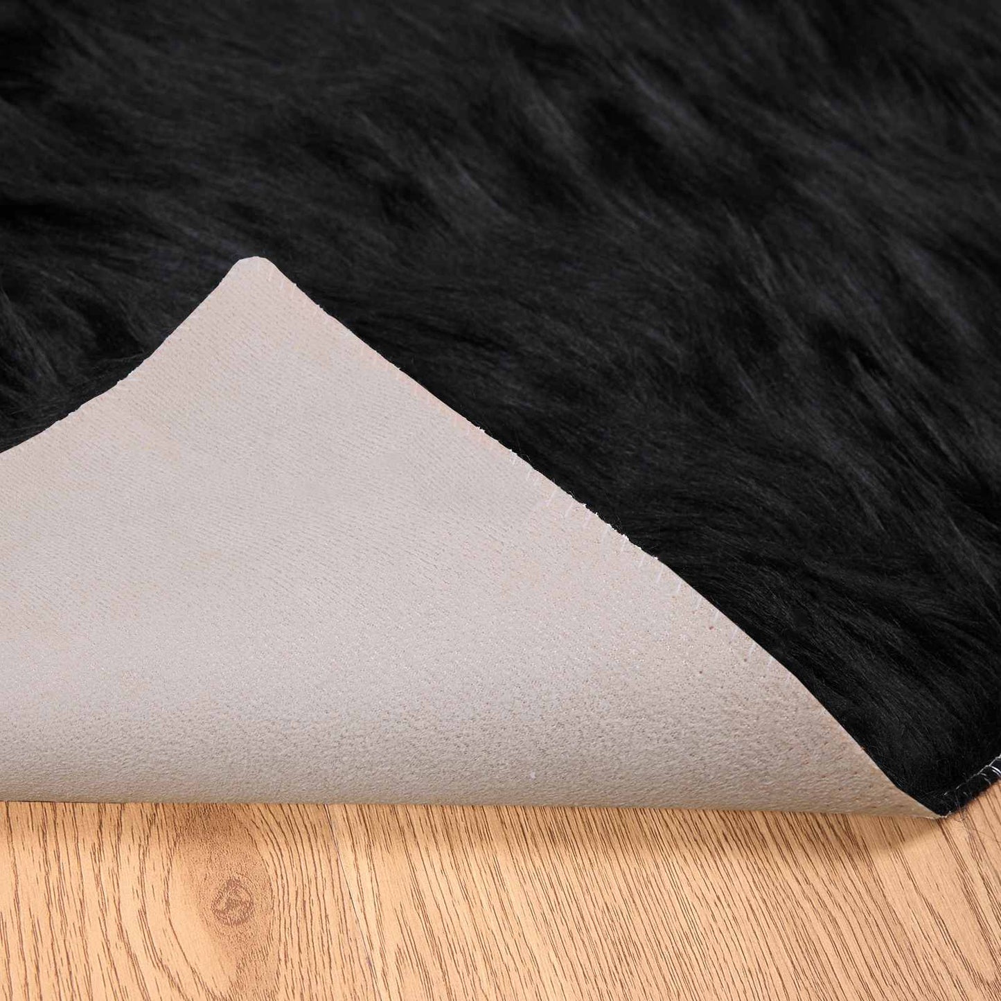 Tapis en fausse fourrure de mouton Tafalla Noir 100 x 200 cm Polyester