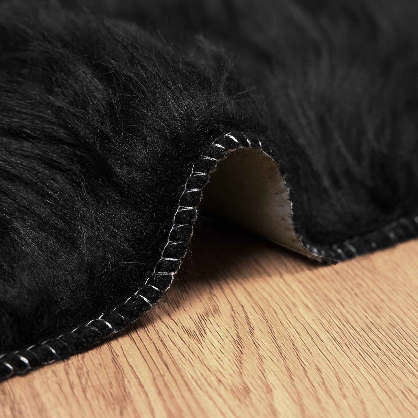 Tapis en fausse fourrure de mouton Tafalla Noir 100 x 200 cm Polyester
