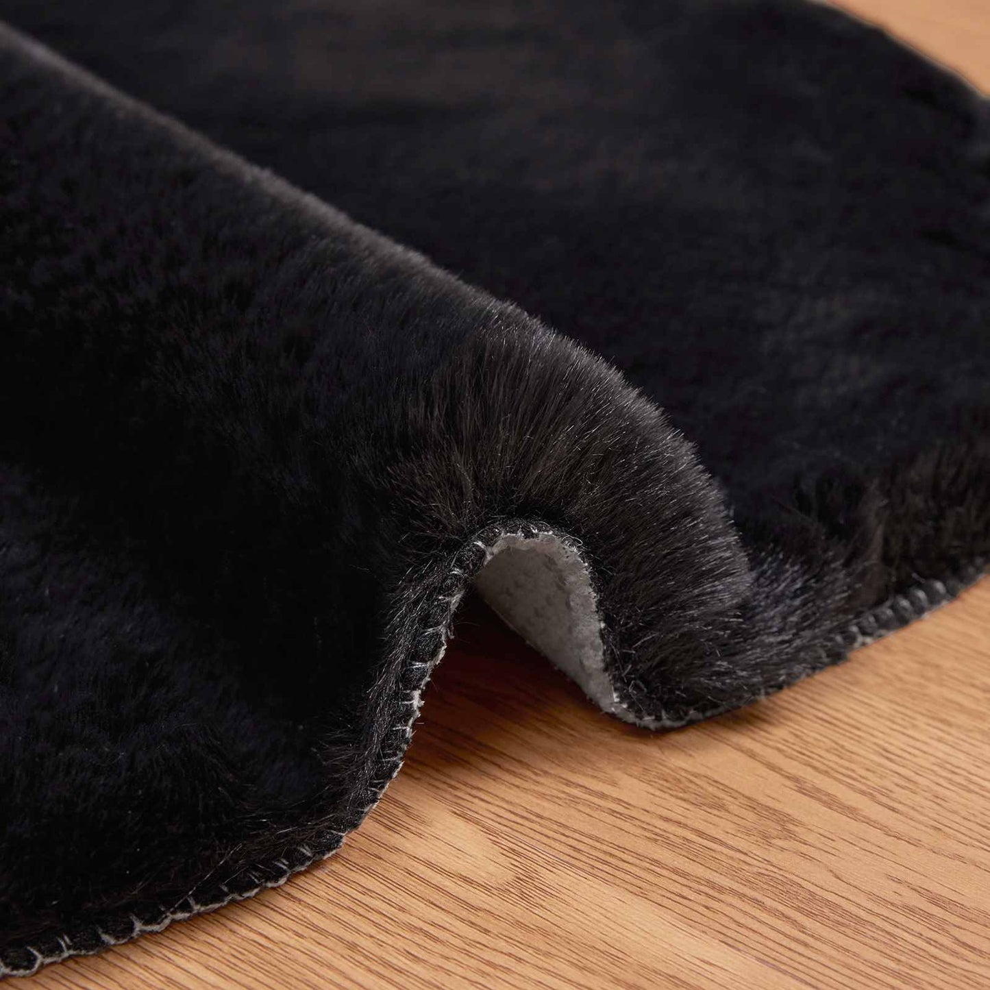 Tapis en fausse fourrure de lapin Olite noir 50 x 80 cm polyester